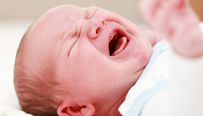An up-close look at a screaming baby.